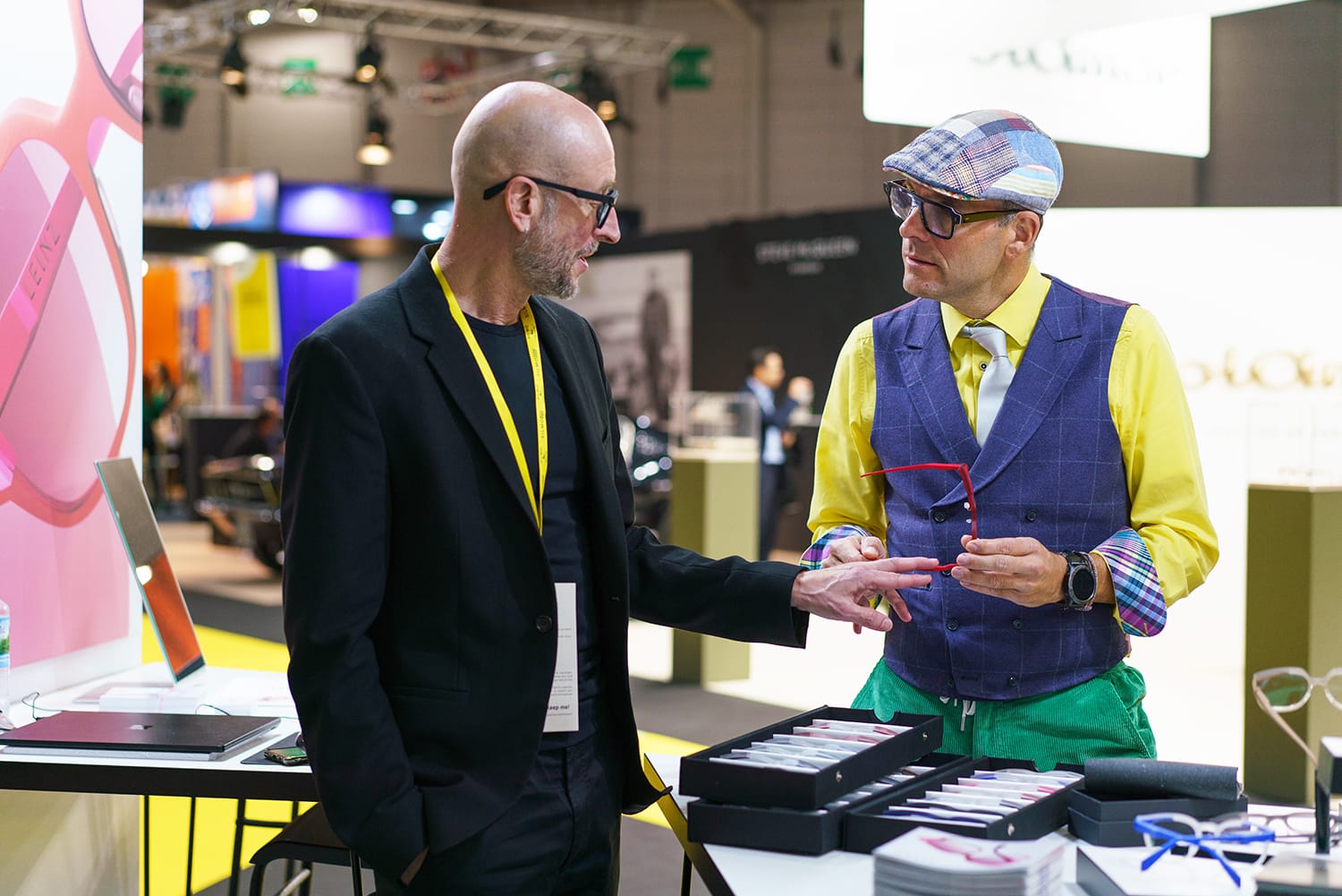 Two men discuss frames at SILMO Paris