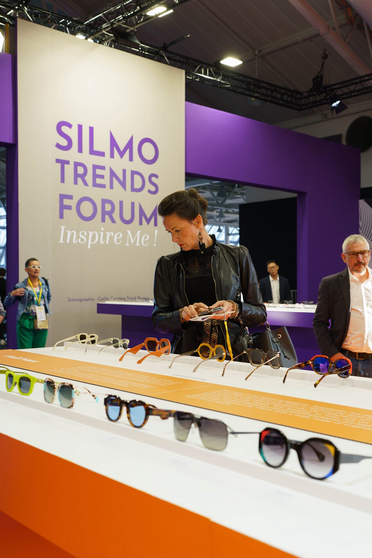 A woman inspects frames at SILMO Paris