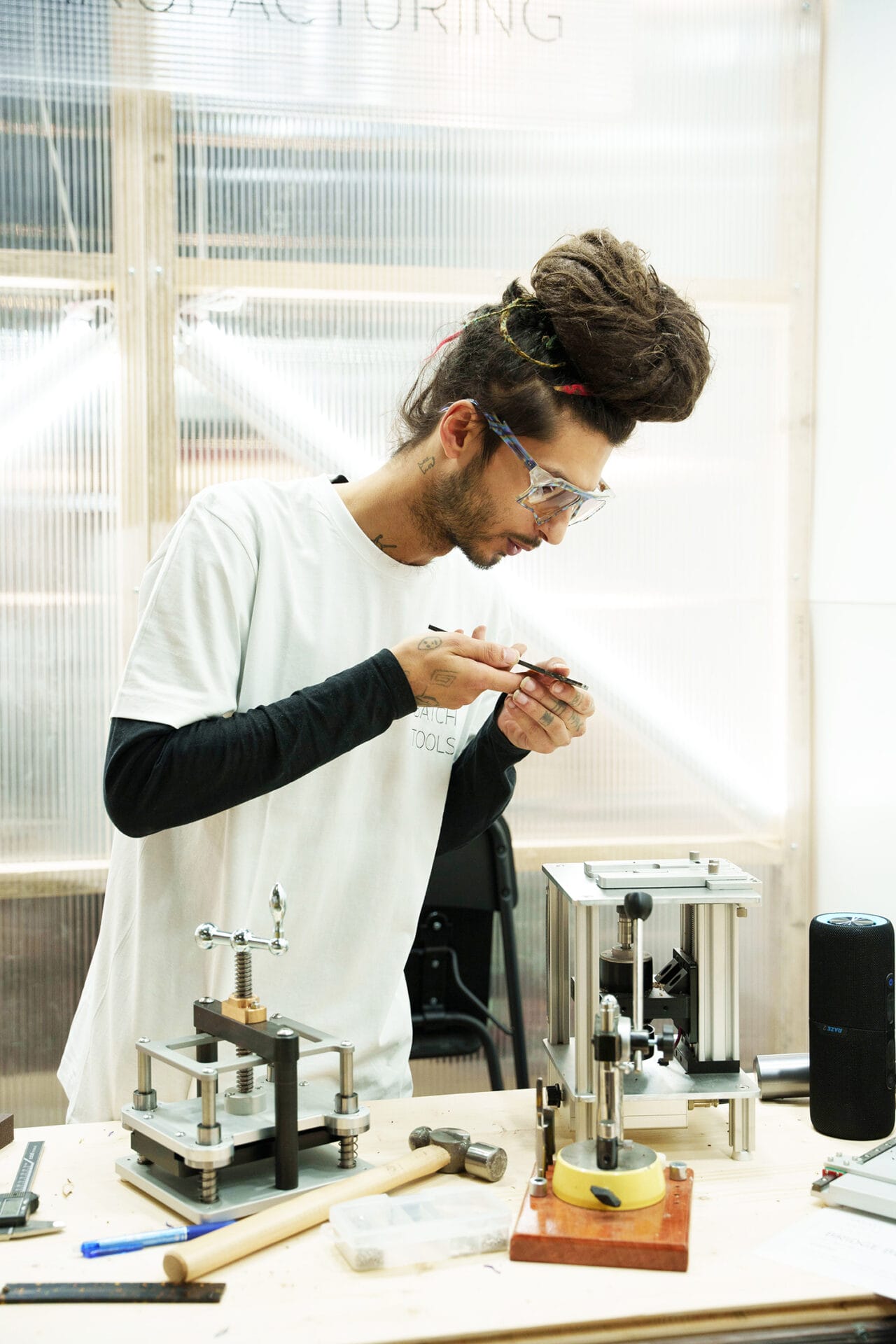 A man working on eyewear at SILMO Paris