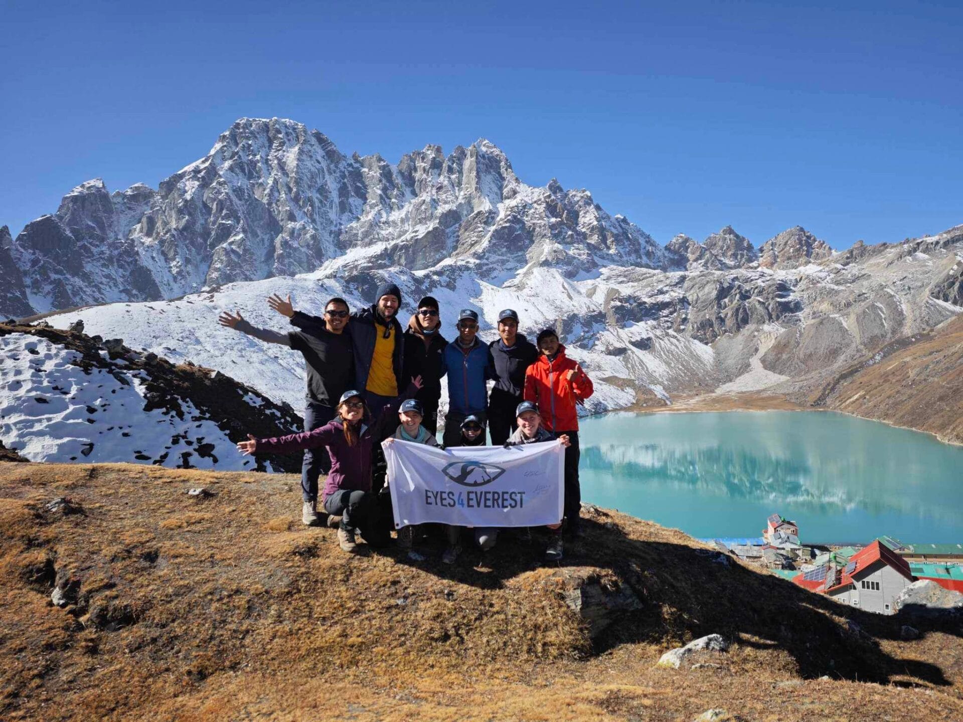 IMG_7523 group of Eyes4Everest volunteers on top of a mountain in Nepal