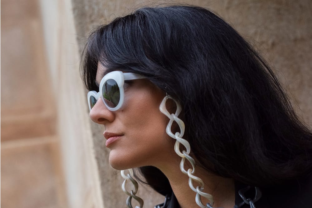 Woman wearing sunglasses from the Vita Ombré capsule