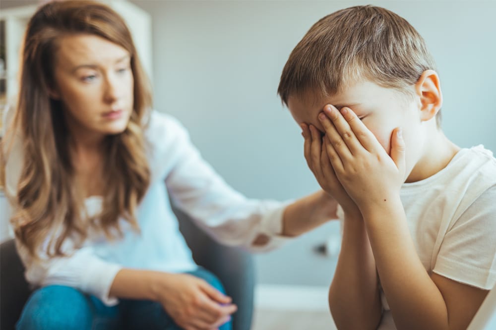 Image showing parent comforting anxious child.