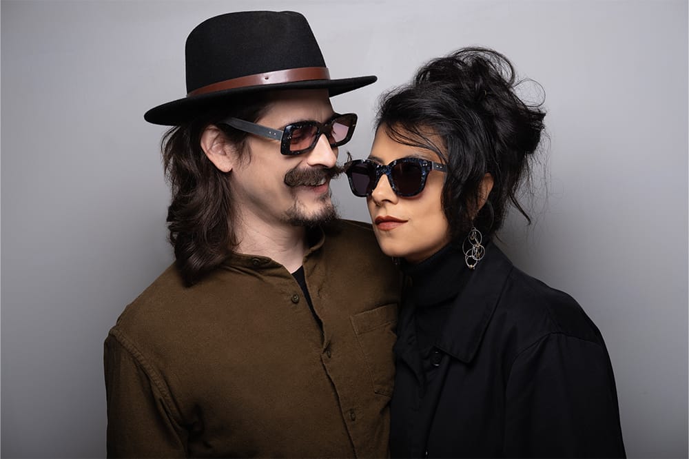 Two people wearing Objekt Eyewear frames
