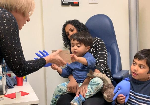 Child being examined by eye health professional