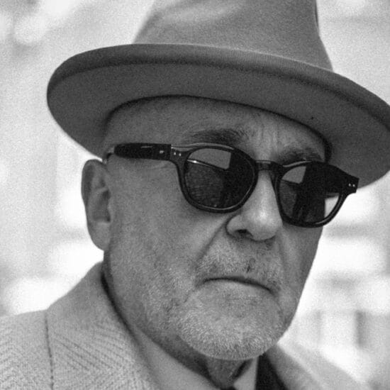 Black series by Linda Farrow. Image shows man wearing sunglasses