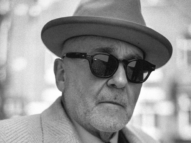 Black series by Linda Farrow. Image shows man wearing sunglasses