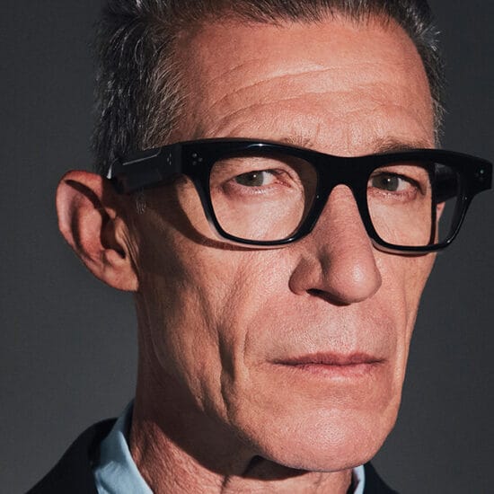 Man with glasses showing a bold frame selection
