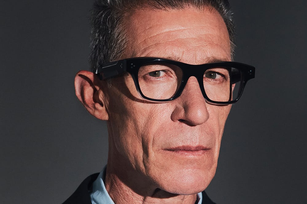 Man with glasses showing a bold frame selection
