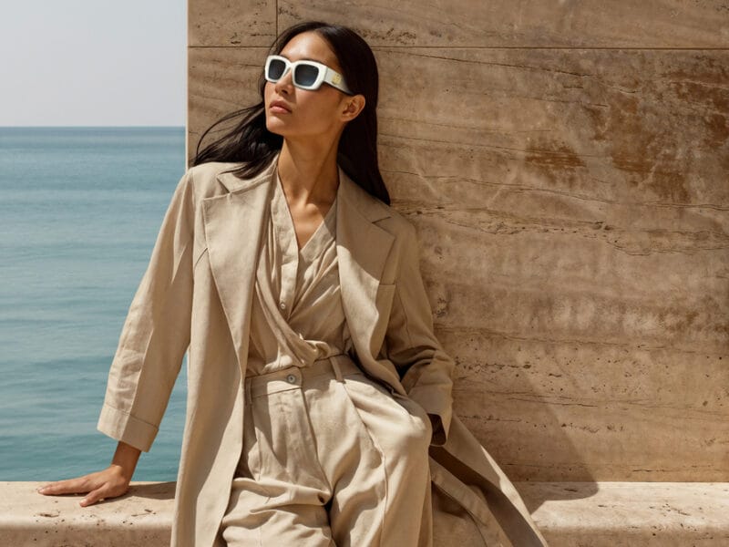 woman wearing INVU Fashionista Edition against the backdrop of the ocean