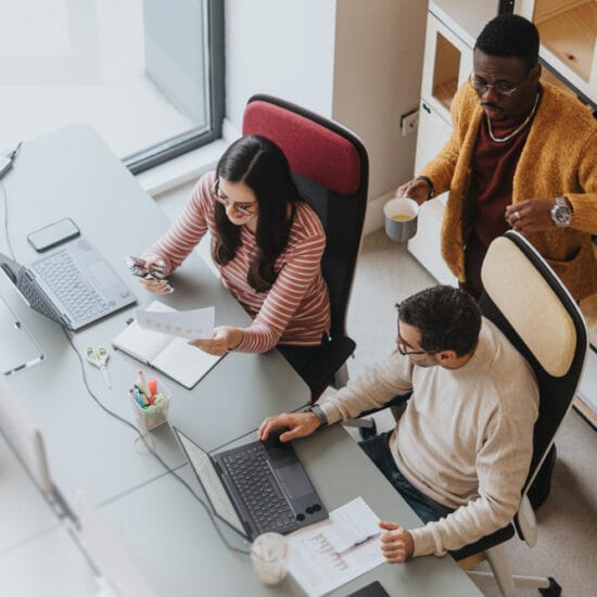 Image shows office space, people wearing glasses with occupational lenses