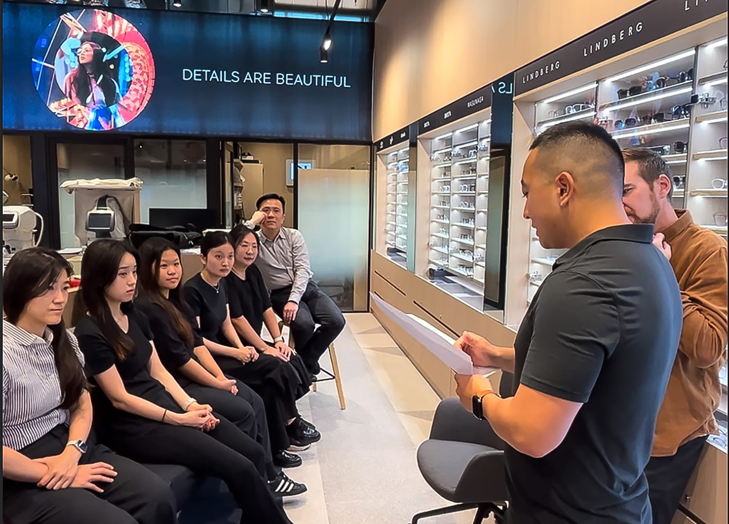The 1001 Optometry Chatswood Chase team in a mentoring and training session with Dylan Oblein and Edward Lee.