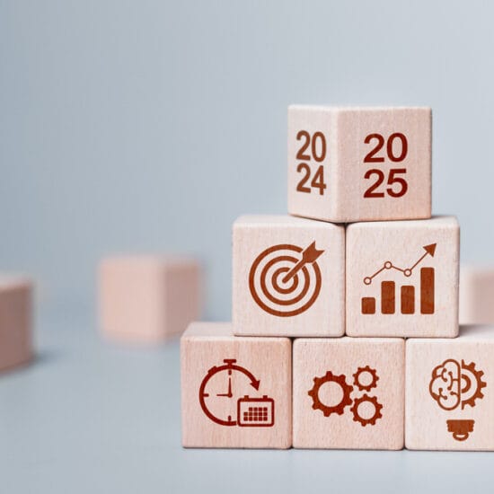 Play block with financial figures on them representing preparing for EOFY success