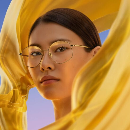 product shot of woman wearing glasses with lens coatings