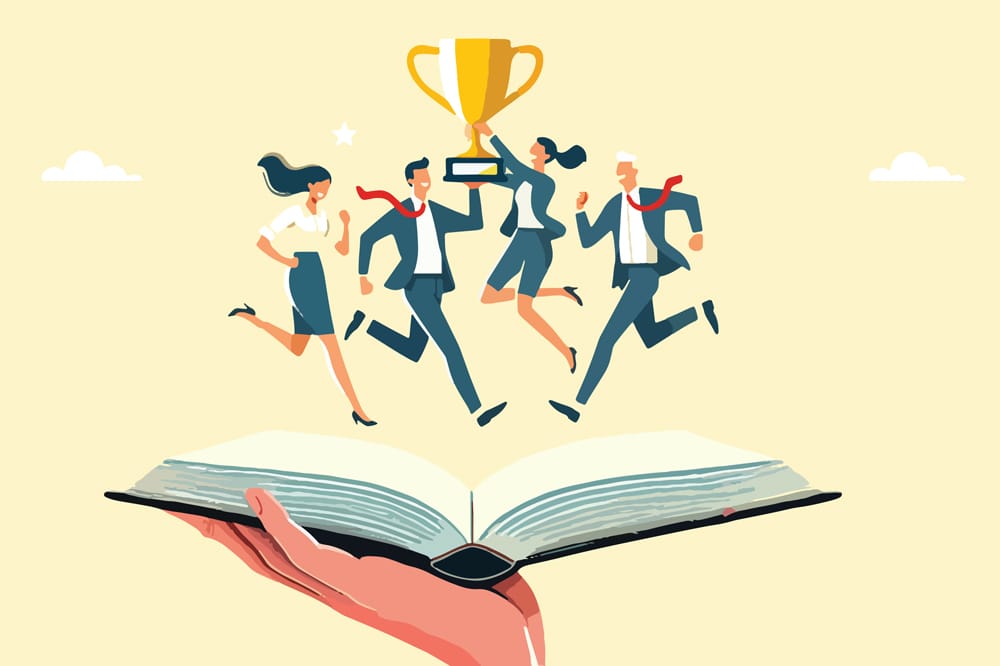 Graphic of hand holding an open book. There are figures on top of the book in business clothing holding a trophy, illustrating concept of excellence in staff training culture