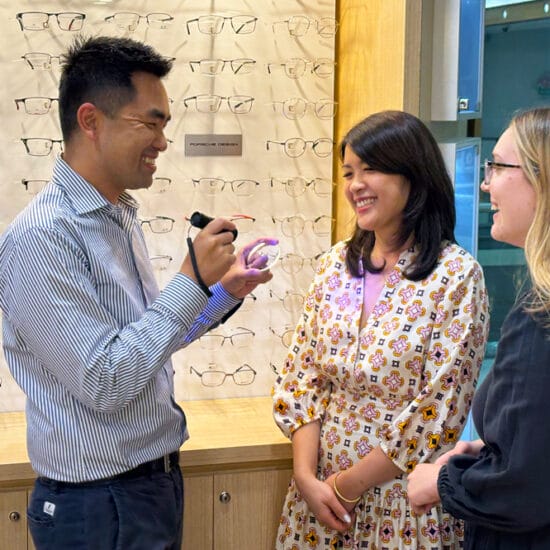 John Nguyen with Kim Nguyen (left) and Molly Reay (right).