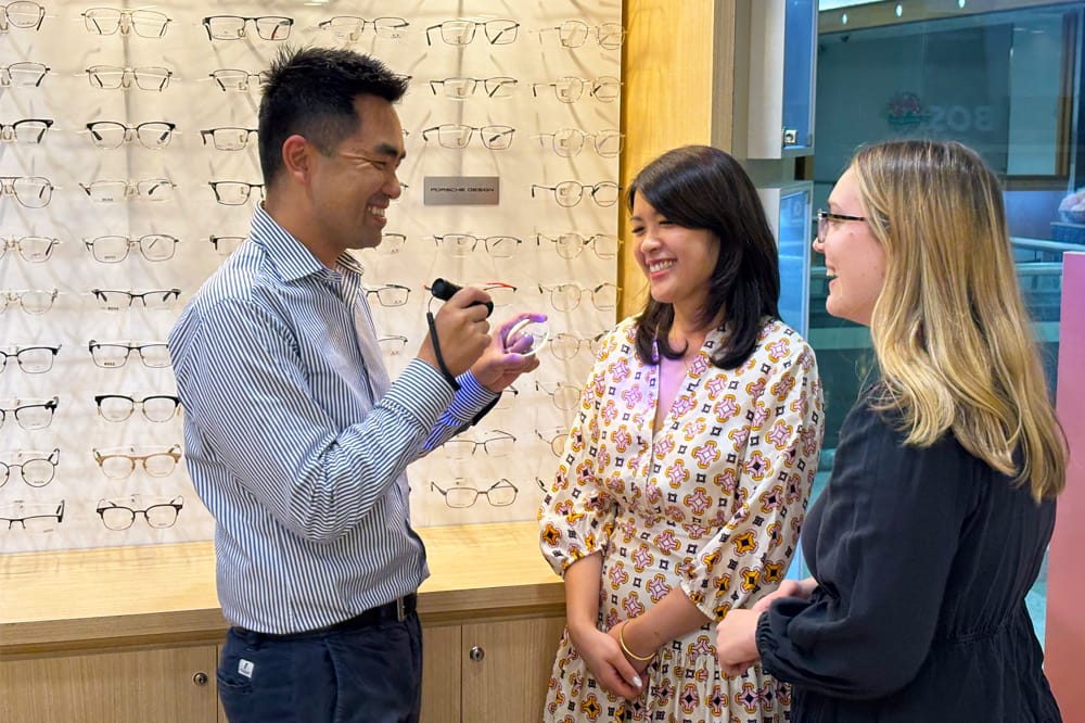 John Nguyen with Kim Nguyen (left) and Molly Reay (right).