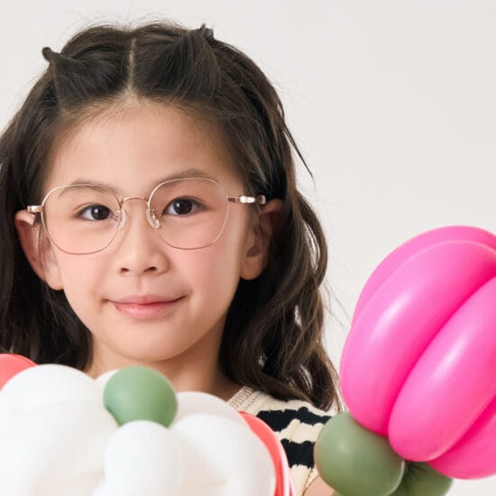 Girl with balloons wearing Lipo eyewear