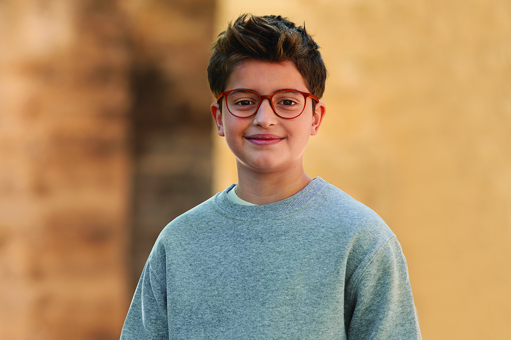 child wearing HOYA MiyoSmart glasses