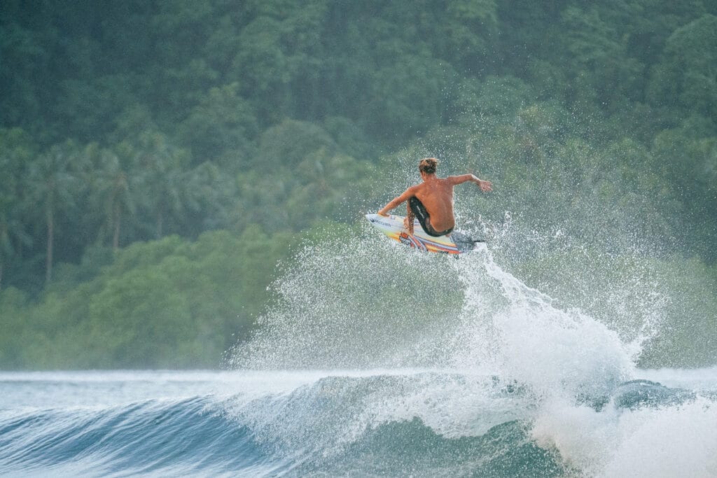 Surfer jumping the wave. Photography by Rip Curl