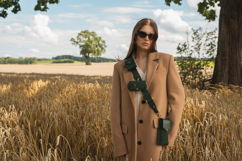 woman weearing ANY DI sunglass holder in a field