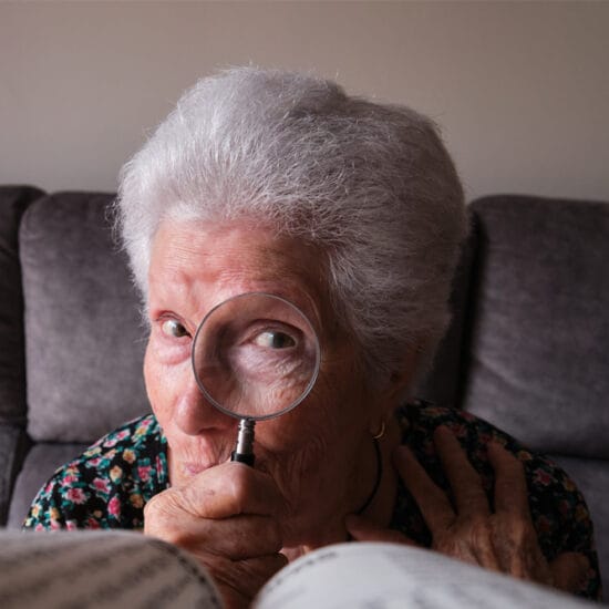 Old woman with glaucoma having difficulty seeing