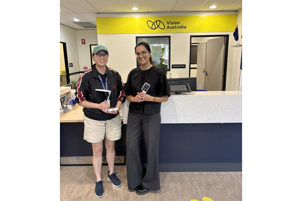Ibtisam Shahbaz with a team member from Vision Australia