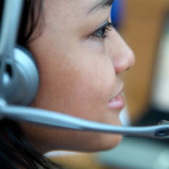 Woman answering phone calls as part of the Eye Connect program