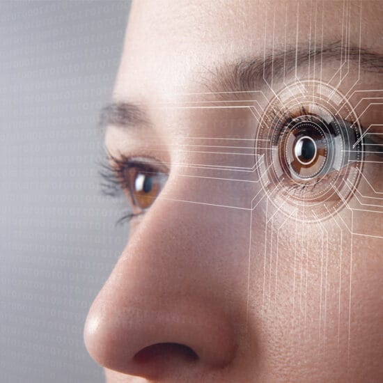 Close up of woman's eye with a diagram over it, representing macular disease research