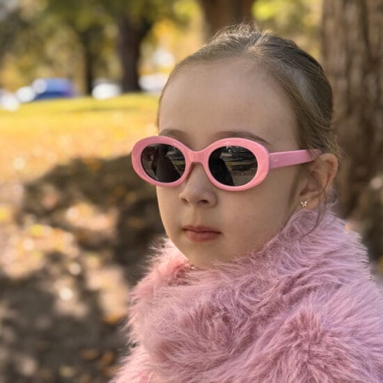 girl wearing OLIVAH. glasses