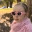 girl wearing OLIVAH. glasses