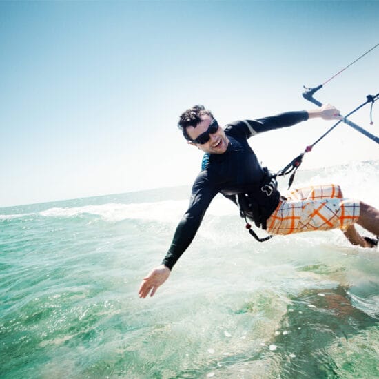 Man kitesurfing with sports eyewear